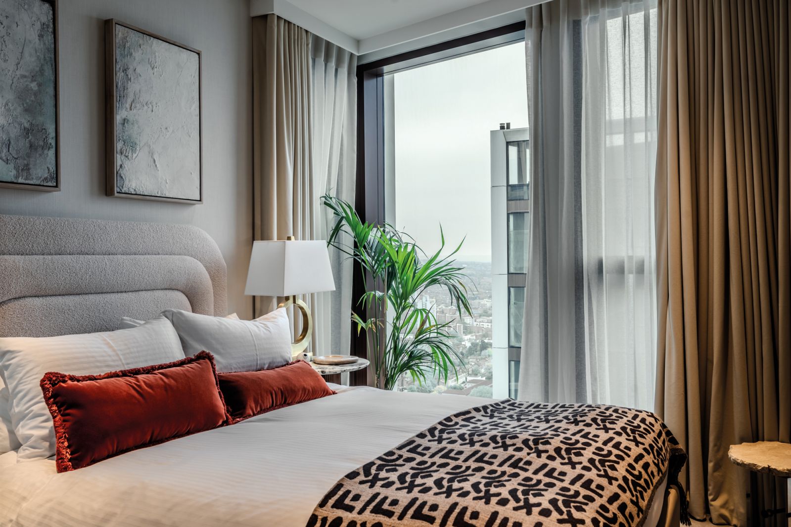The third bedroom is inspired by French retro design, accented with subtle African prints