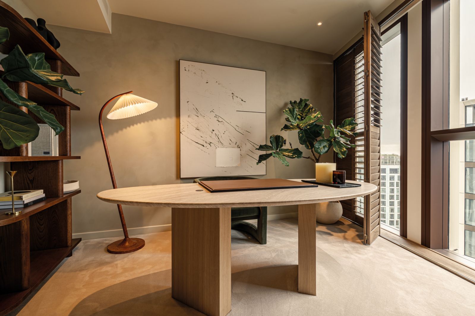 The home’s studio was designed as a tranquil study, with a statement oval table as the focal point