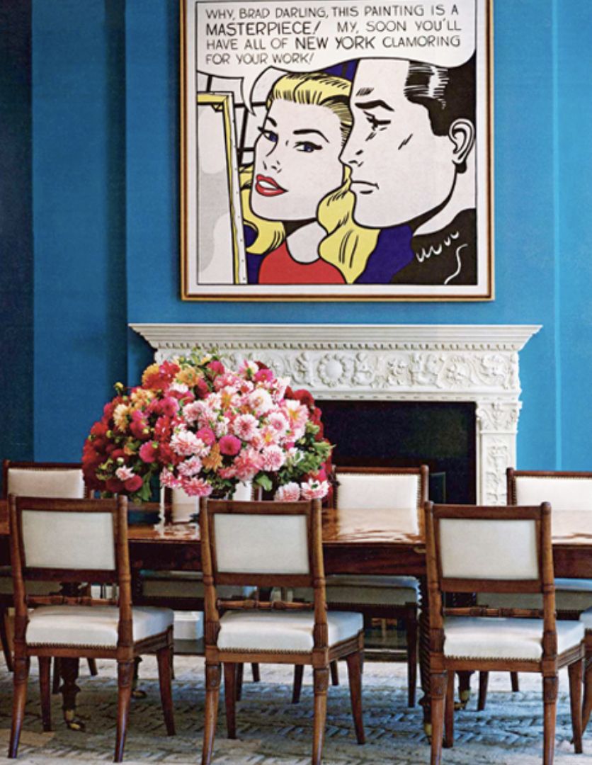 Agnes Gund’s dining room, where Kristen McGinnis set Roy Lichtenstein’s Masterpiece, 1962, against one of the designer’s signature blue hues and added an antique English dining table and chairs (Photo: Instagram/@art_collectors_at_home)