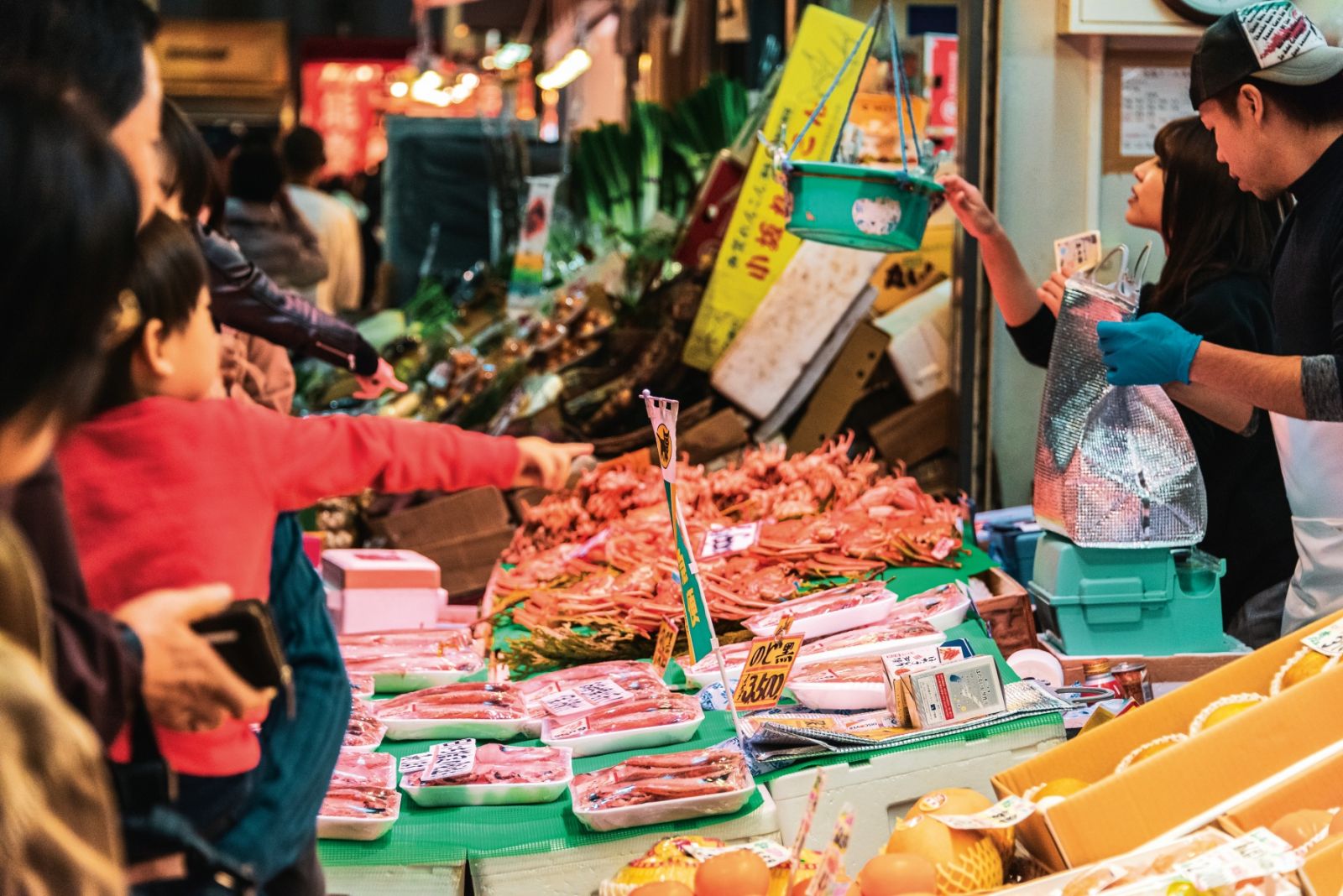Chubu, Japan - November 17, 2018: a busy and colorful Omicho Market in Kanazawa with many customers and many tourists.