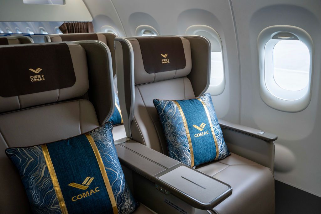 Business Class seats are being showcased inside the cabin of the COMAC C919, developed by the Chinese aircraft manufacturer Commercial Aircraft Corporation of China, Ltd. (COMAC), at Hong Kong International Airport during a Media Preview in Hong Kong, China, on December 13, 2023. The COMAC C919 and ARJ21, both made and developed by China, are visiting Hong Kong for the first time and will conduct a demonstration flight over Victoria Harbour this Saturday. (Photo by Vernon Yuen/NurPhoto via Getty Images)