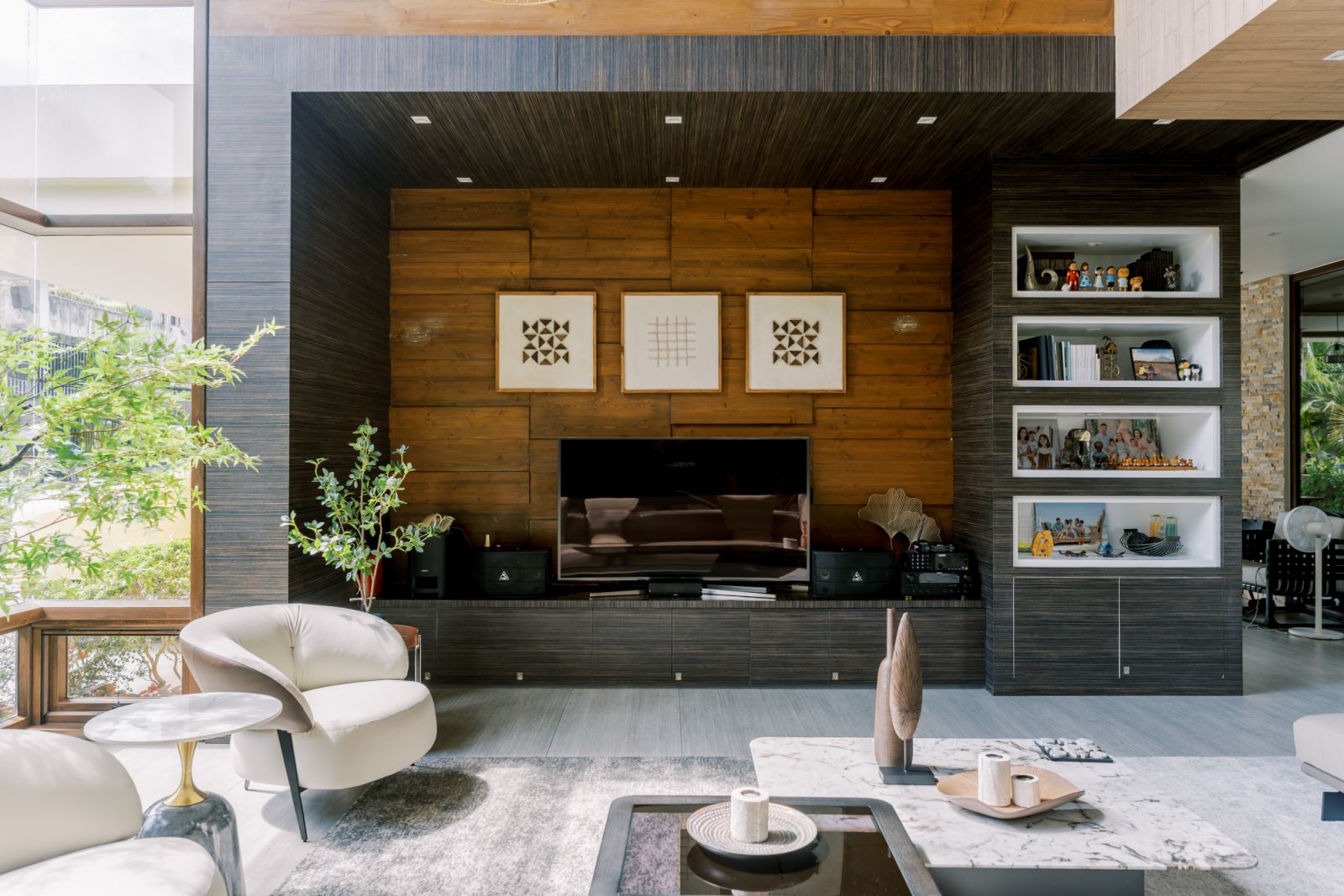 The entertainment area of a living room in an Ozamiz, Misamis Occidental home designed by M + S Studio