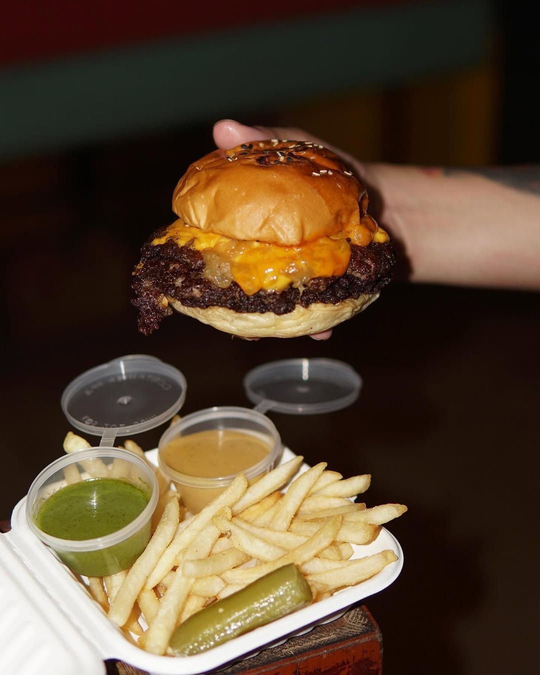 A classic, juicy smash burger with a side of fries and their terragon aioli and honey mustard BBQ sauce (Image: Triple Decker)