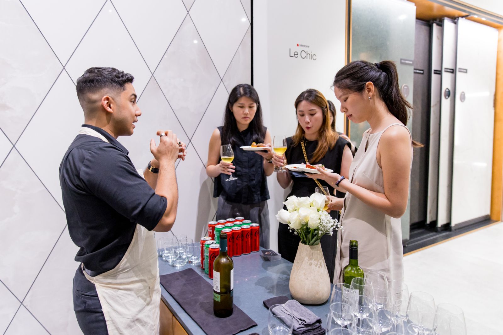 Guests enjoying small bites and drinks