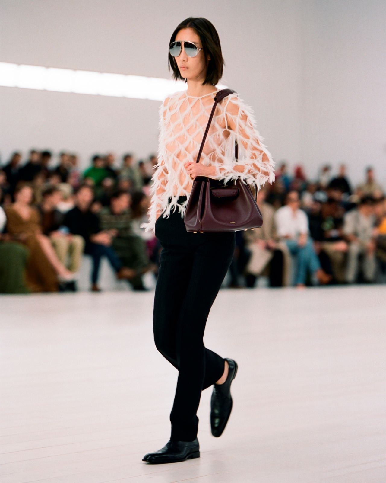 A model dons the Madrid bag on the runway of the Loewe spring/summer 2025 show (Photo: Loewe)