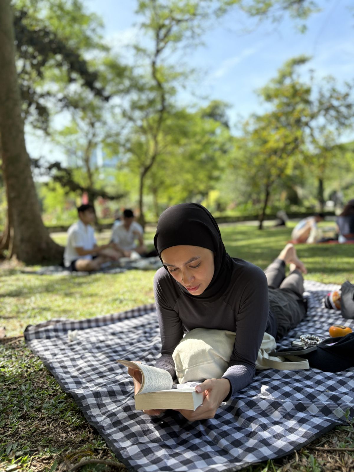 In a world dictated by capitalism, participants surrender instead to literature and leisure