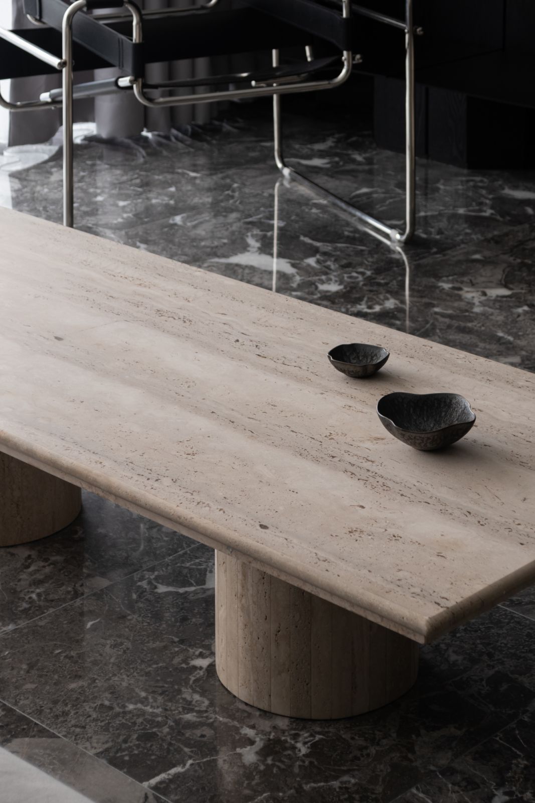 A bespoke coffee table serves as both functional surface and artistic statement