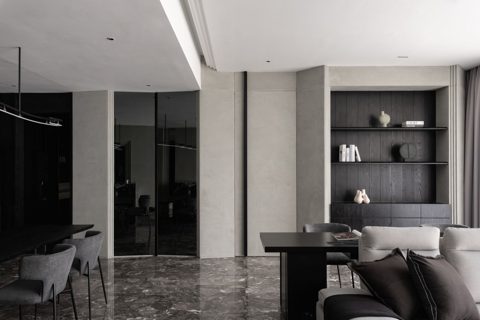 Matte black veneer panels with precisely placed LED lighting and a Bvlgari Black Marble handle redefine the master bedroom threshold