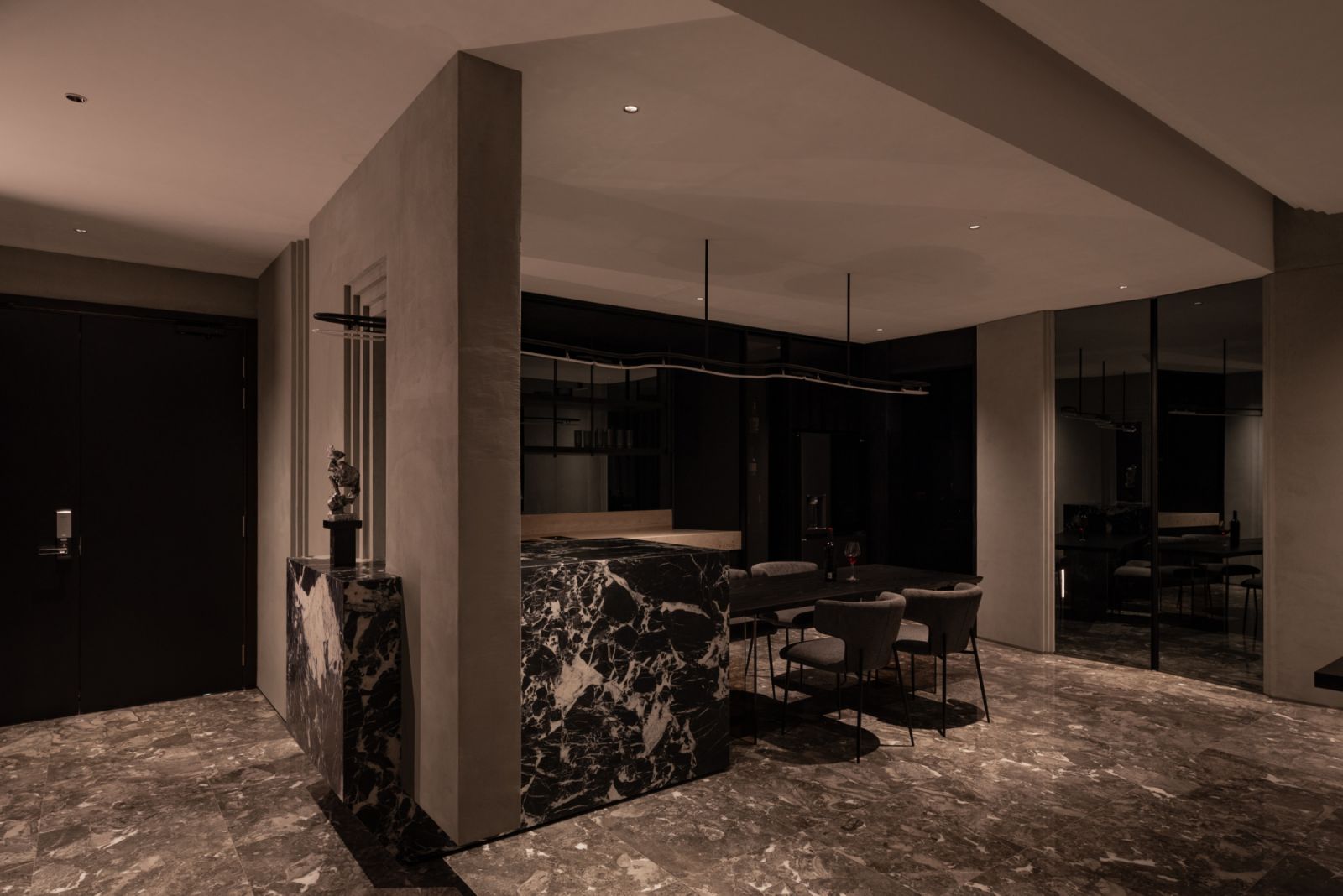 The dramatic entrance feature merges architectural elements with the overall design philosophy