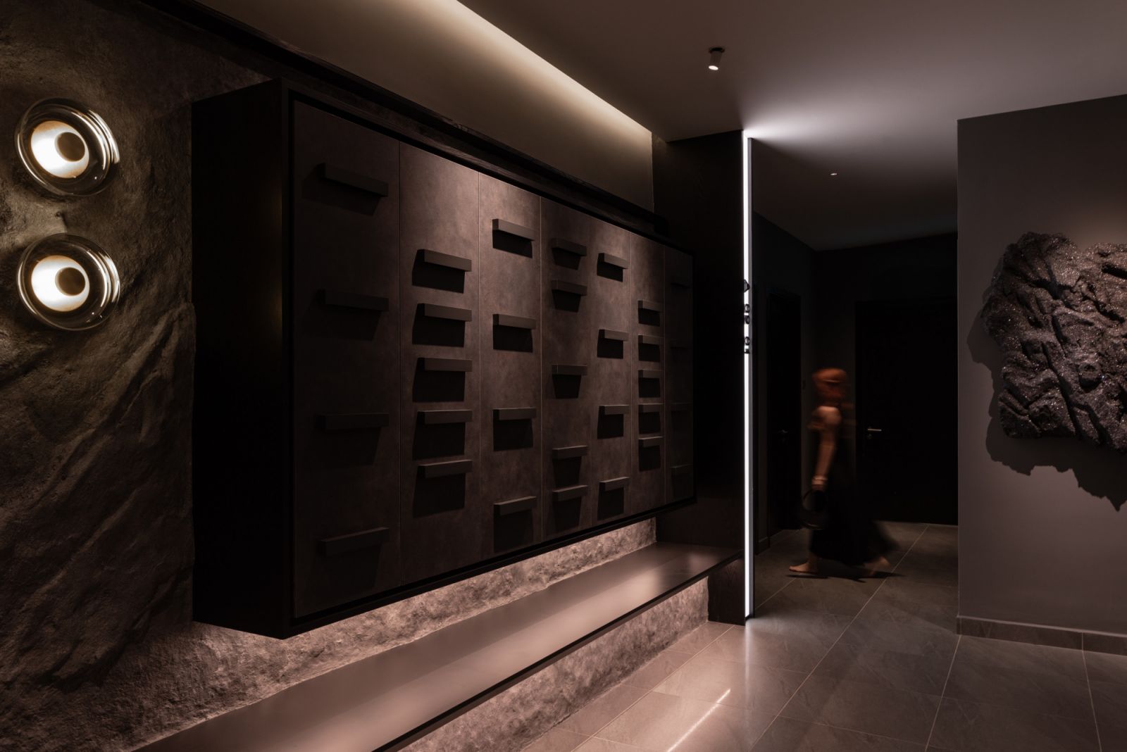 The lift lobby renovation extends the condominium's nocturnal concept beyond the residence itself