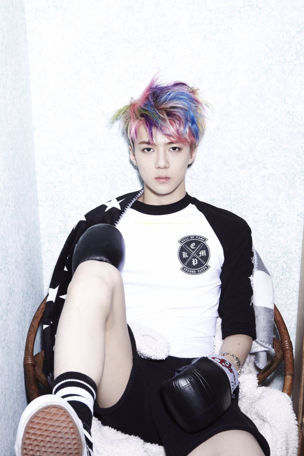 Bubblegum Beginnings. Debuting with ‘MAMA’, Sehun sported the hallmarks of early K-pop fashion: brightly dyed hair and bold prints. There was a youthful chaos to it all—an experimental playground of oversized jackets, high-top sneakers, and the occasional studded accessory. He wore it like a badge of honour (Photo: SM Entertainment)