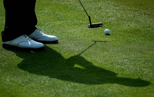 DUBAI, UNITED ARAB EMIRATES – 1 FEBRUARY 2014: The shadow of France’s Julian Quesne is captured mid-swing during the third round of the Omega Dubai Desert Classic. Photo: Marwan Naamani/AFP via Getty Images