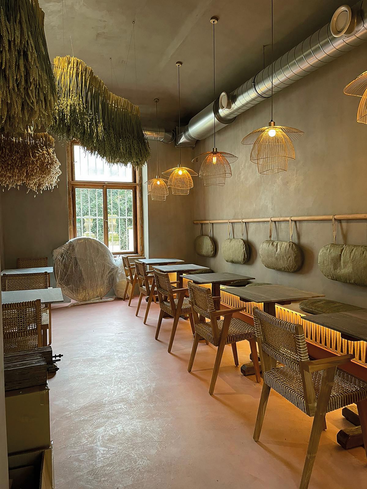 The interiors of Czech restaurant Cruz Letná, with cushion covers crafted out of Malai