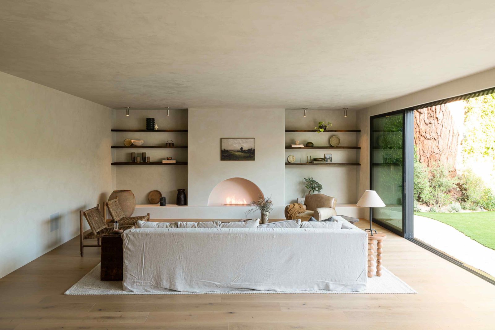 The living room with neutral-coloured plaster walls and white oak flooring