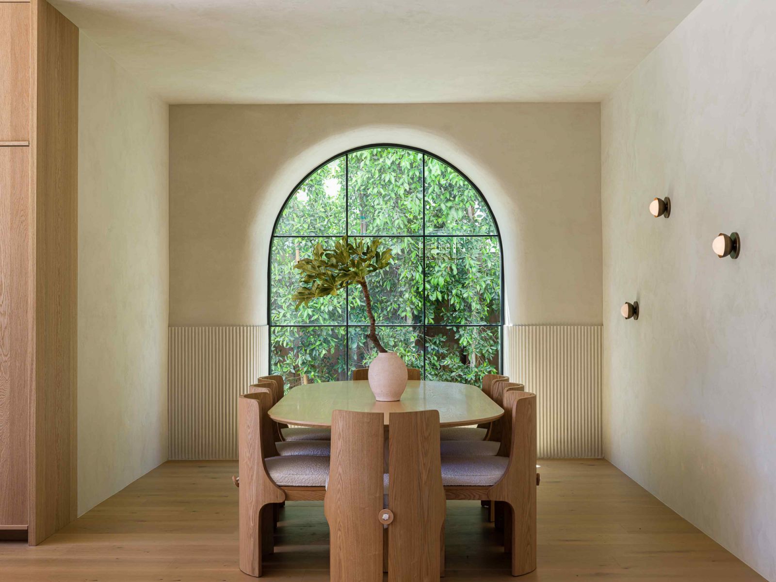 Natural light permeating through the arched grid window