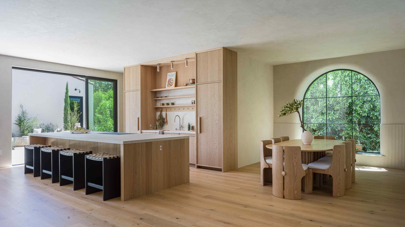 A mix of finishes in the open-concept dining and kitchen area