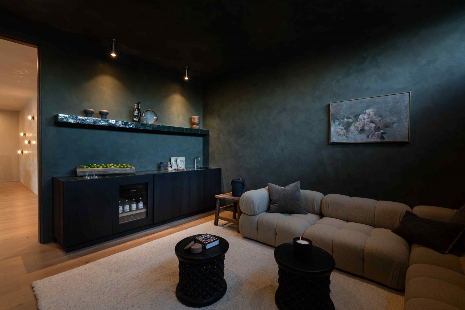 The theatre room with dark green plaster finishes