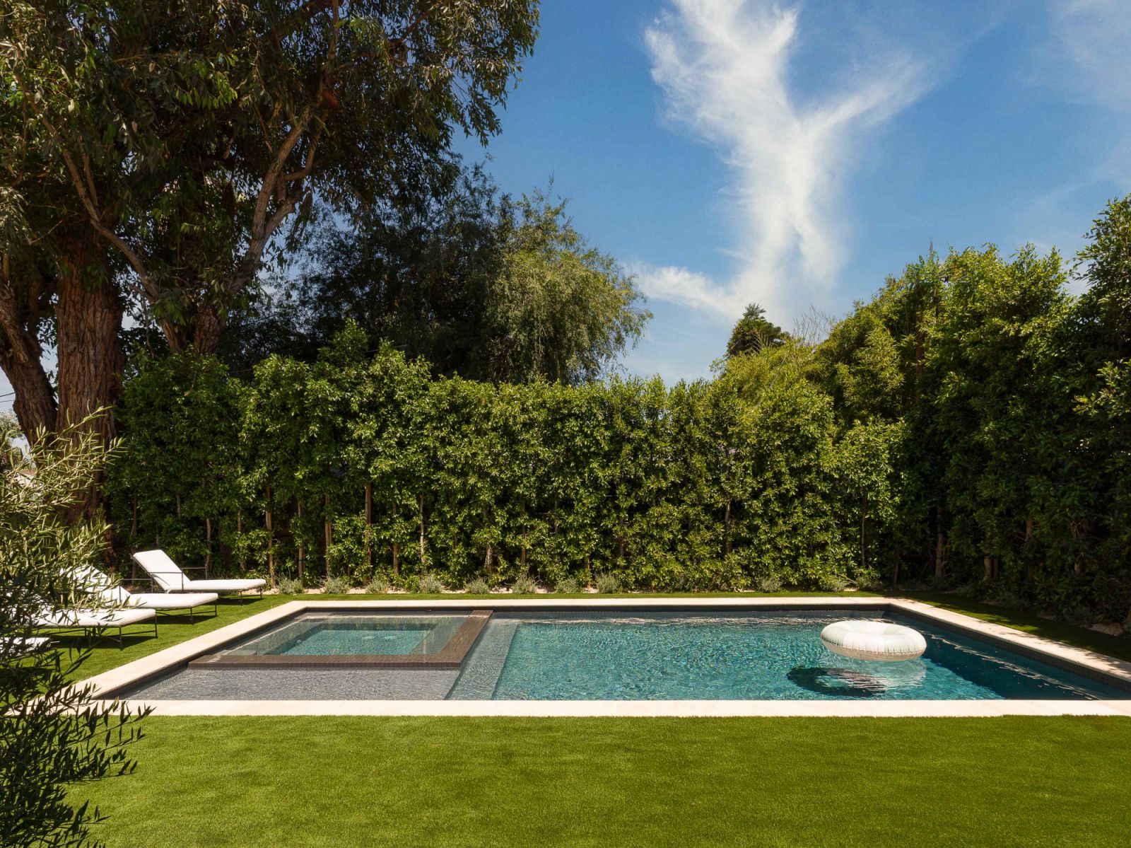 Tall hedges provide privacy from the neighbouring homes