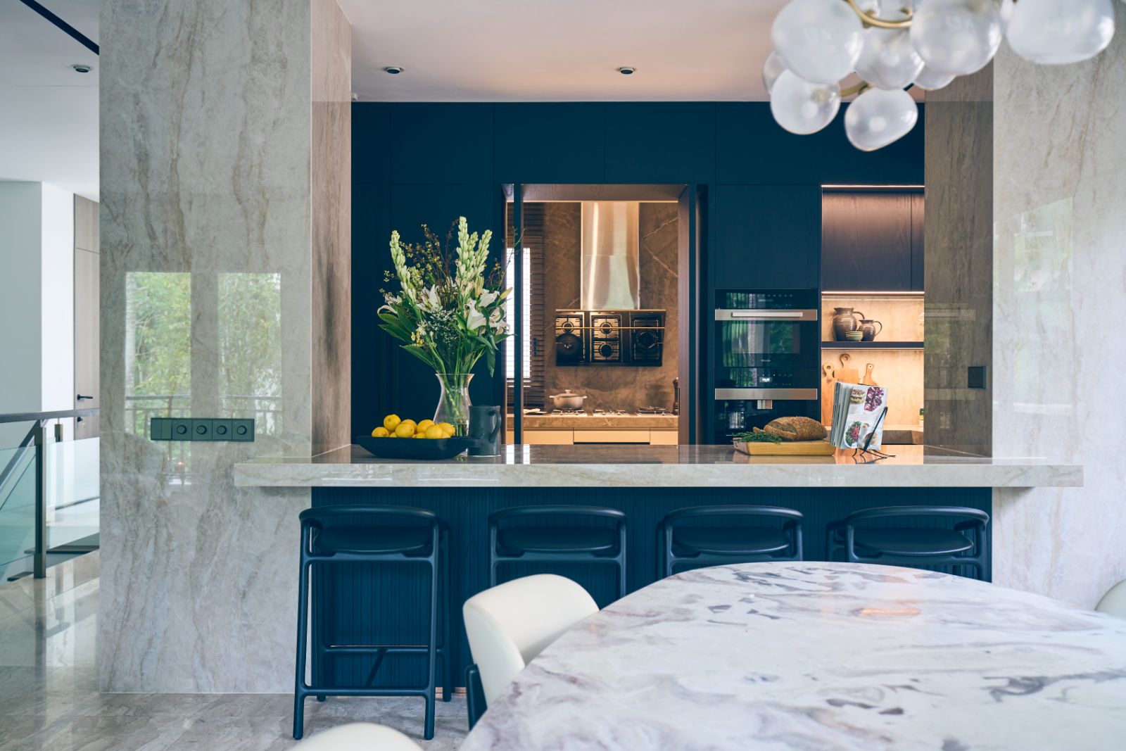A view of the townhouse’s dry and wet kitchens from the dining area