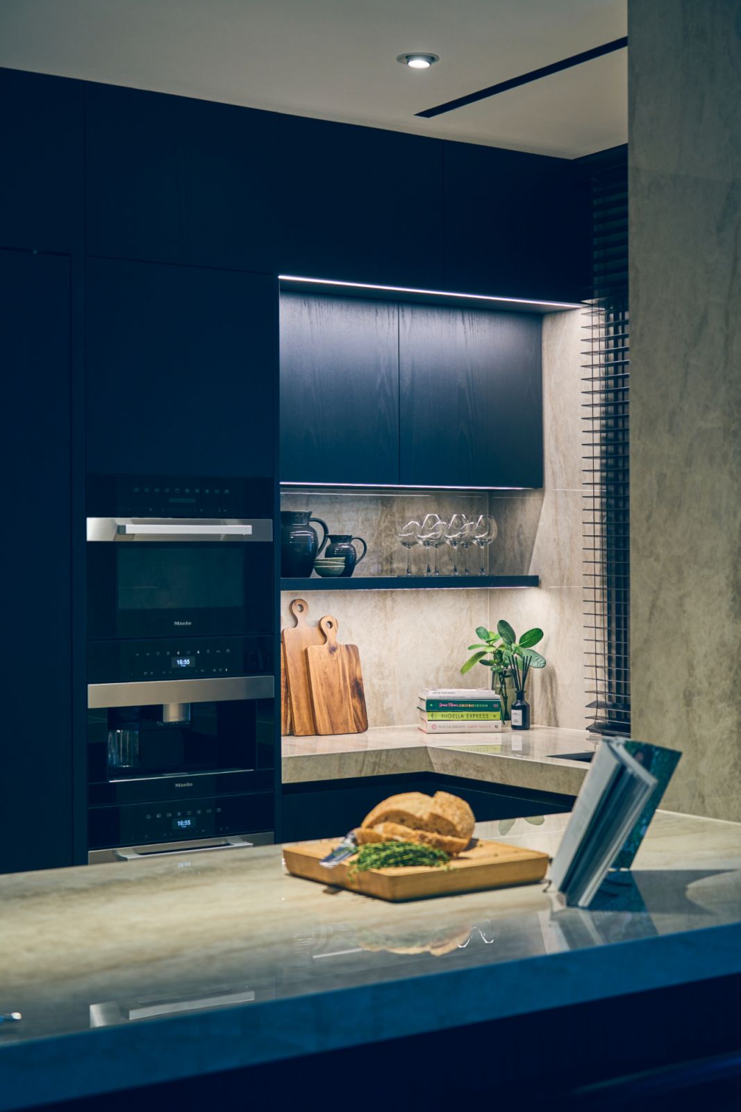 The townhouse’s dry kitchen is dressed in calming deep blue