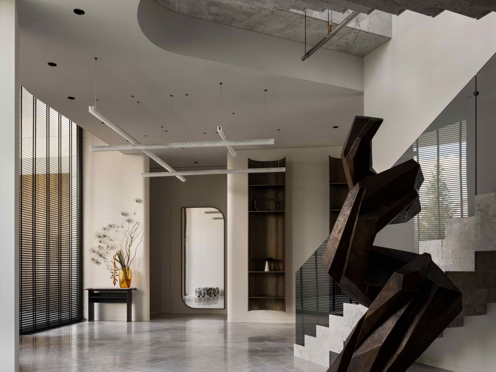 The custom bronze Tree of Life sculpture by Fedor and Polina Abramov anchors the grand hallway