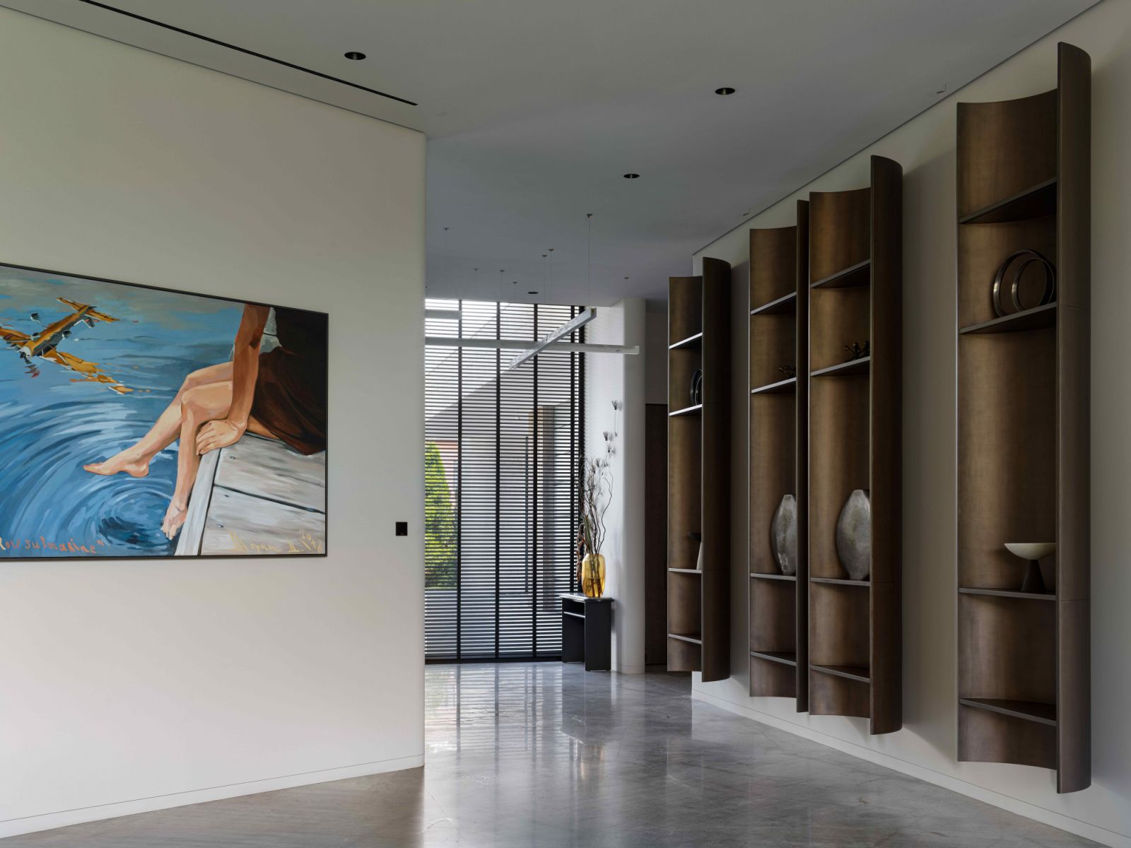 Bespoke wooden shelving in a metallic bronze hue for displays of decorative pieces