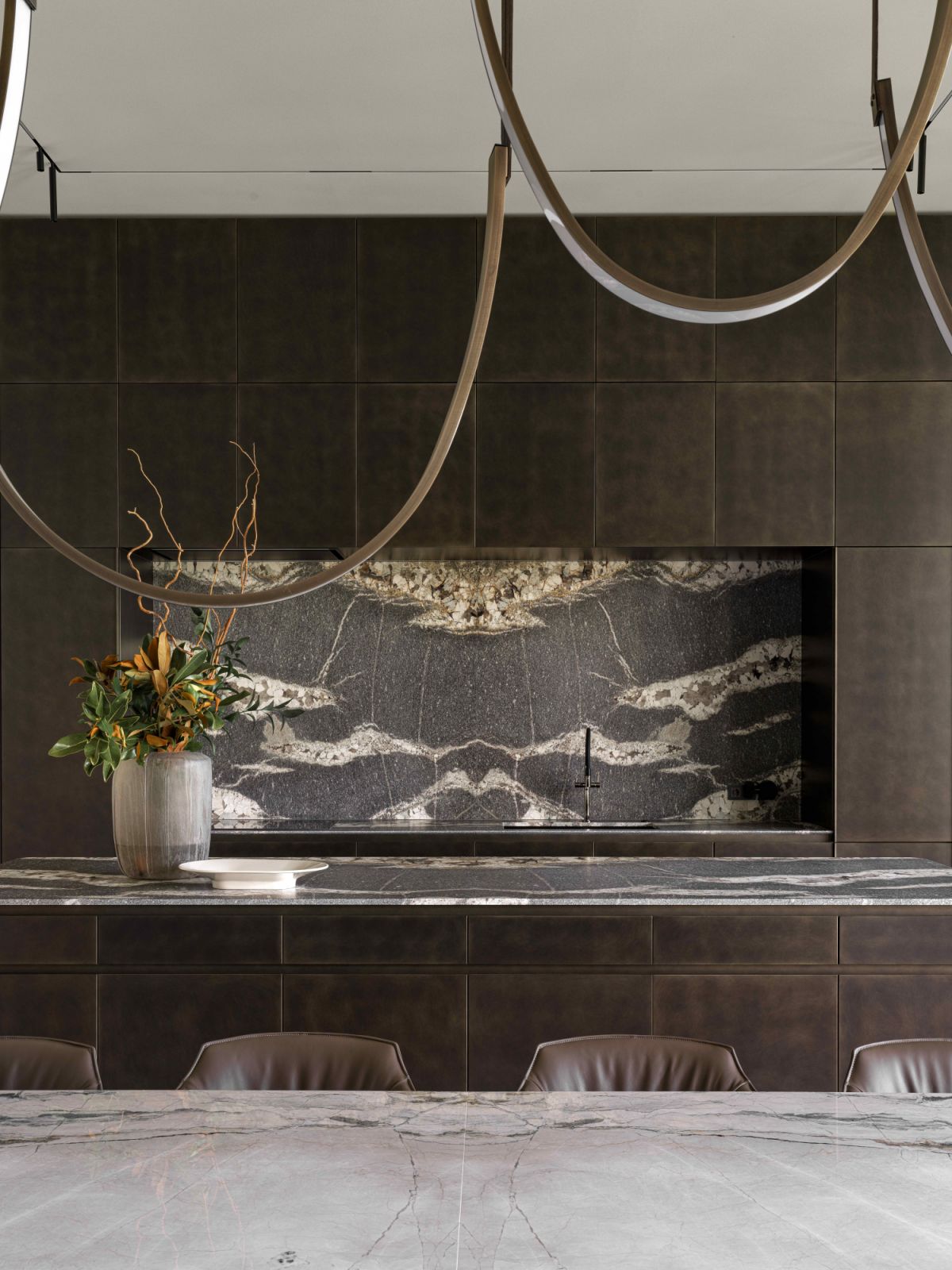 The beautiful natural pattern on the kitchen backsplash provides the perfect backdrop