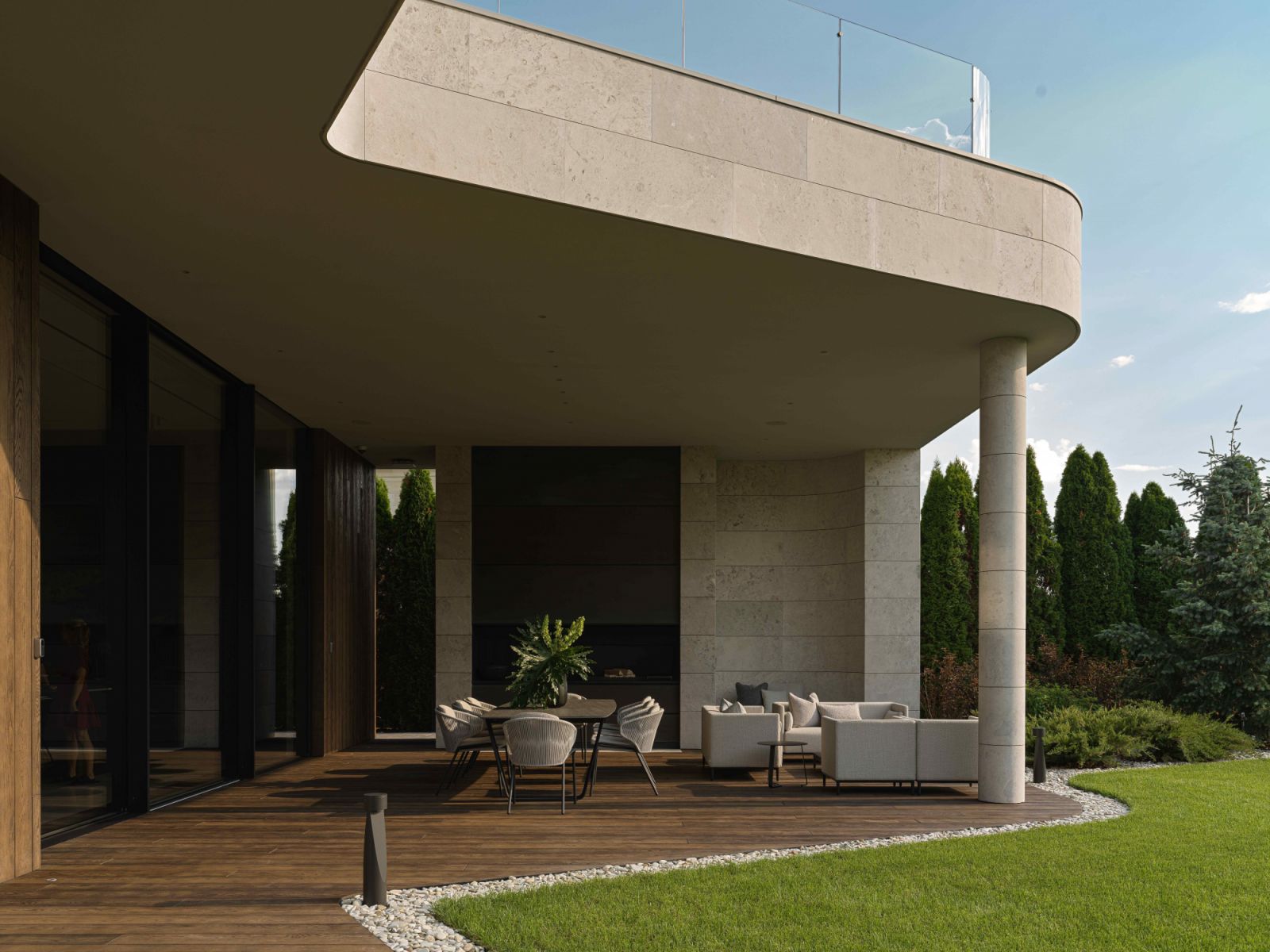 Smooth, curved forms of natural dolomite dominate the façade