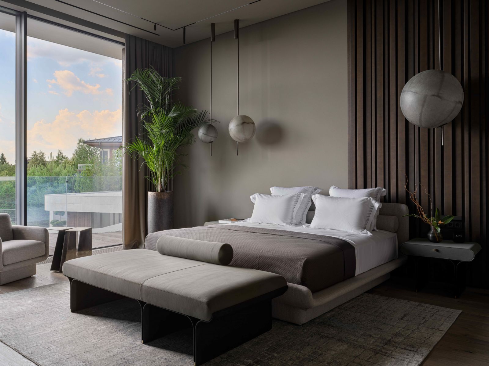 The master bedroom with grooved wooden panels in dark metallic bronze