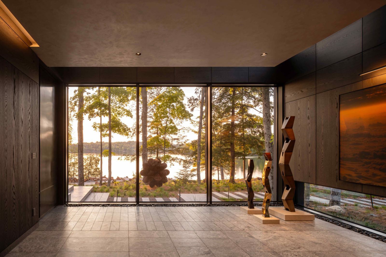 Canadian artist An Te Liu’s Tropos sculptures reflect the evening sun in the wood-panelled entry gallery