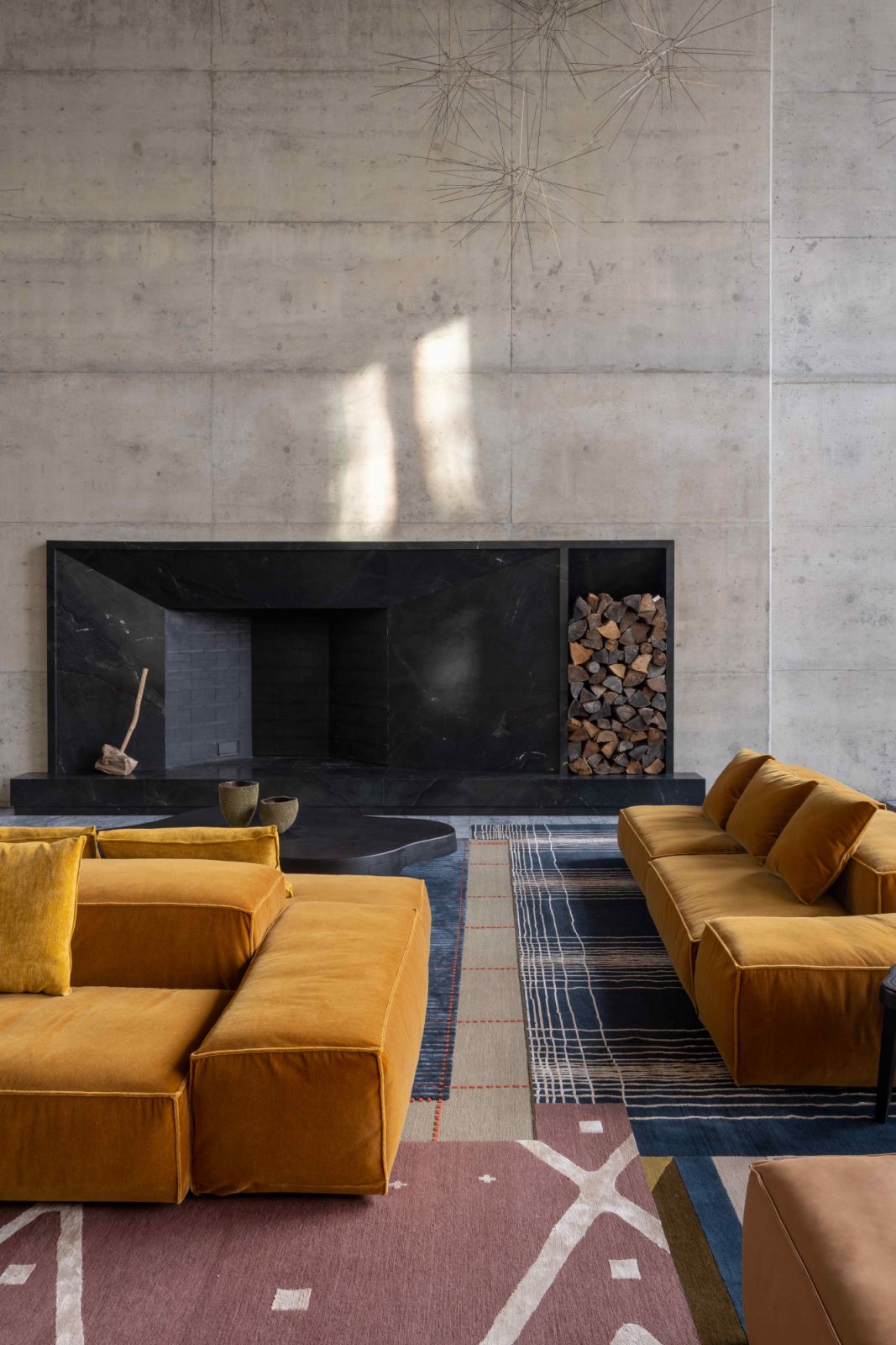 A 2,000-sq-ft rug combines four different designs to subtly divide four seating groups within the grand living area