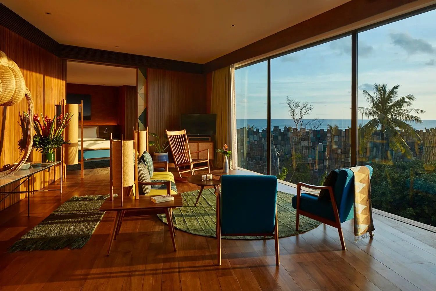 Ocean-view suite at Katamama Bali showcasing mid-century inspired furnishings, timber paneling and expansive windows that blend Indonesian craftsmanship with modernist design principles (Photo: Katamama Bali)