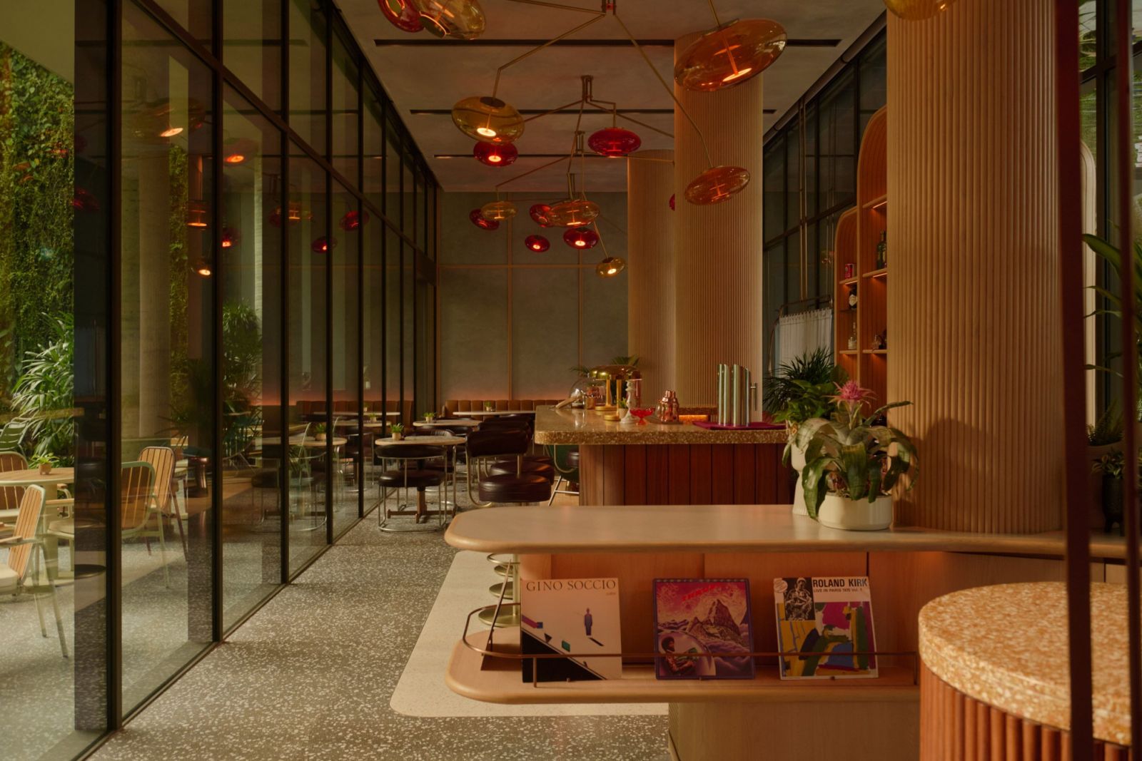 Restaurant at The Standard Singapore with amber disc lighting, ribbed wooden columns, and terrazzo flooring—demonstrating Ministry of Design's sophisticated treatment of the property’s public spaces (Photo: The Standard Singapore)