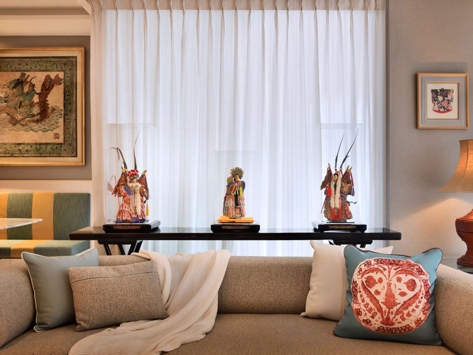Chinese operatic figurines add colour and an Asian flavour to the living area