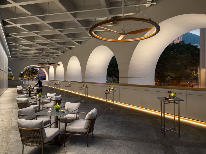 Terrace lounge at The Murray Hong Kong featuring the building’s iconic archways and circular lighting fixtures, demonstrating how Foster + Partners maintained the distinctive architectural elements of the original 1960s government building (Photo: The Murray)