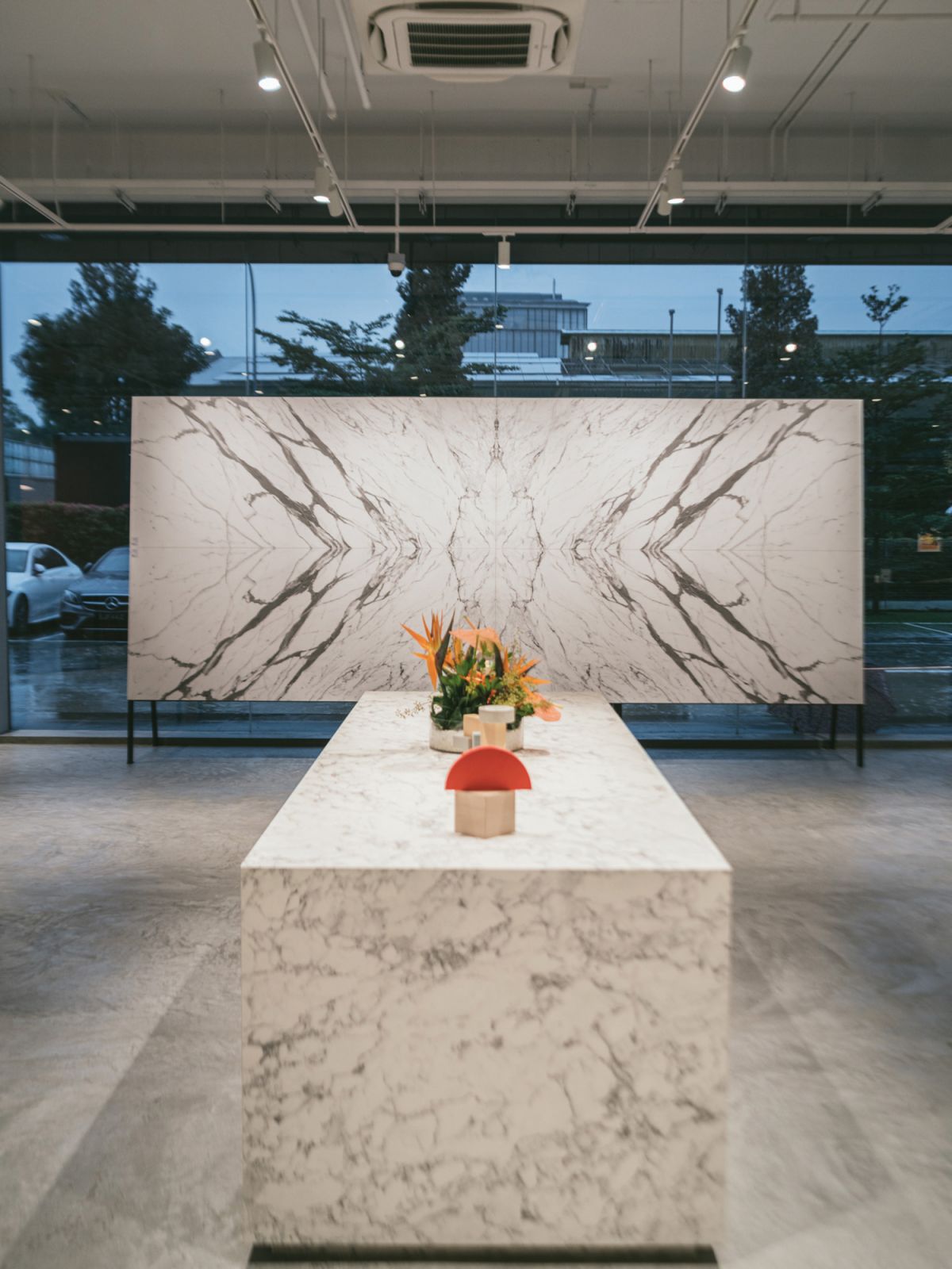 Bookmatched marble-patterned panels take pride of place in this zone