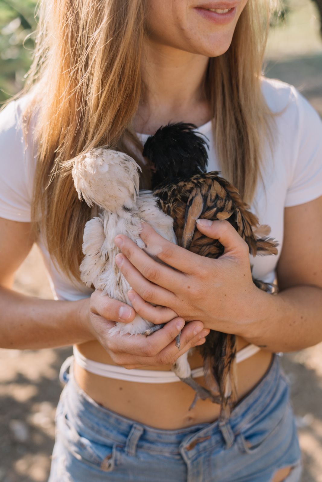 Arianna holding a few of the farm animals
