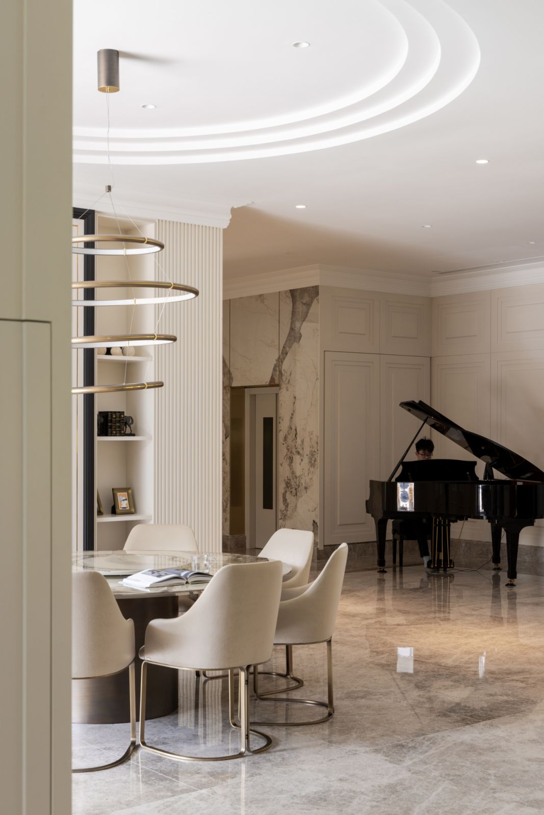The dining area is anchored by a handcrafted Rugiano Italian dining set with the grand piano visible nearby