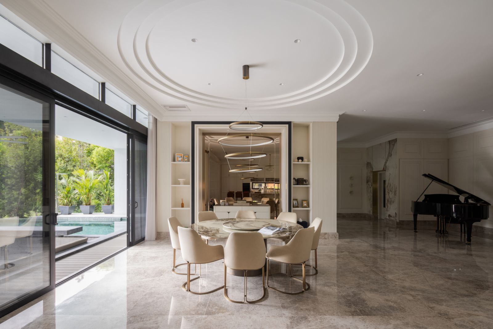 The dining area is anchored by a handcrafted Rugiano Italian dining set with the grand piano visible nearby