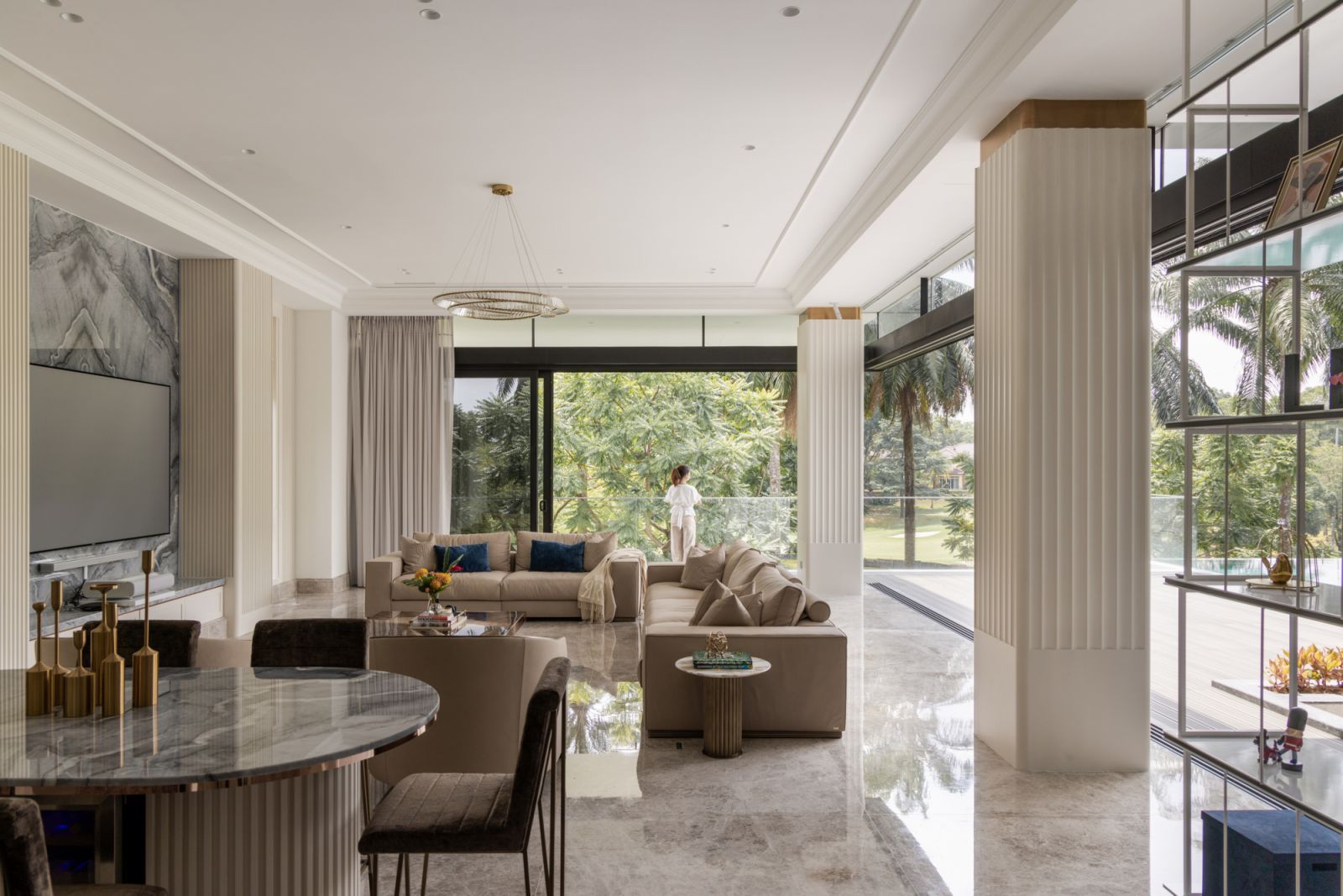 The formal living room has panoramic views of the surrounding golf park landscape