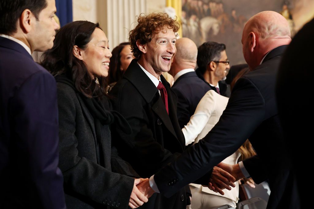 WASHINGTON, DC - JANUARY 20: Meta and Facebook CEO Mark Zuckerberg (C) and his wife Priscilla Chan (L) arrive to the inauguration of U.S. President-elect Donald Trump in the Rotunda of the U.S. Capitol on January 20, 2025 in Washington, DC. Donald Trump takes office for his second term as the 47th president of the United States. (Photo by Chip Somodevilla/Getty Images)