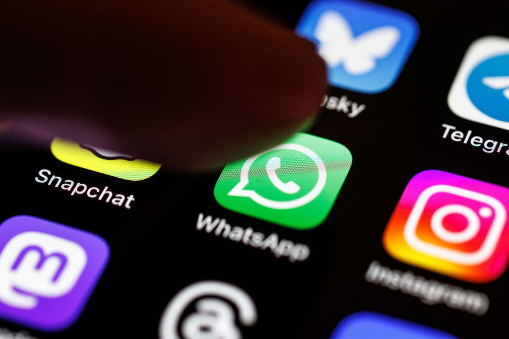 24 March 2025, Bavaria, Munich: The Whatsapp app logo can be seen on the display of a smartphone on March 24, 2025. WhatsApp is an instant messaging service that was founded in 2009 and has been part of Meta Platforms since 2014. Users can exchange text messages, image, video and sound files as well as location information, documents and contact details between two people or in groups via WhatsApp. Photo: Matthias Balk/dpa (Photo by Matthias Balk/picture alliance via Getty Images)