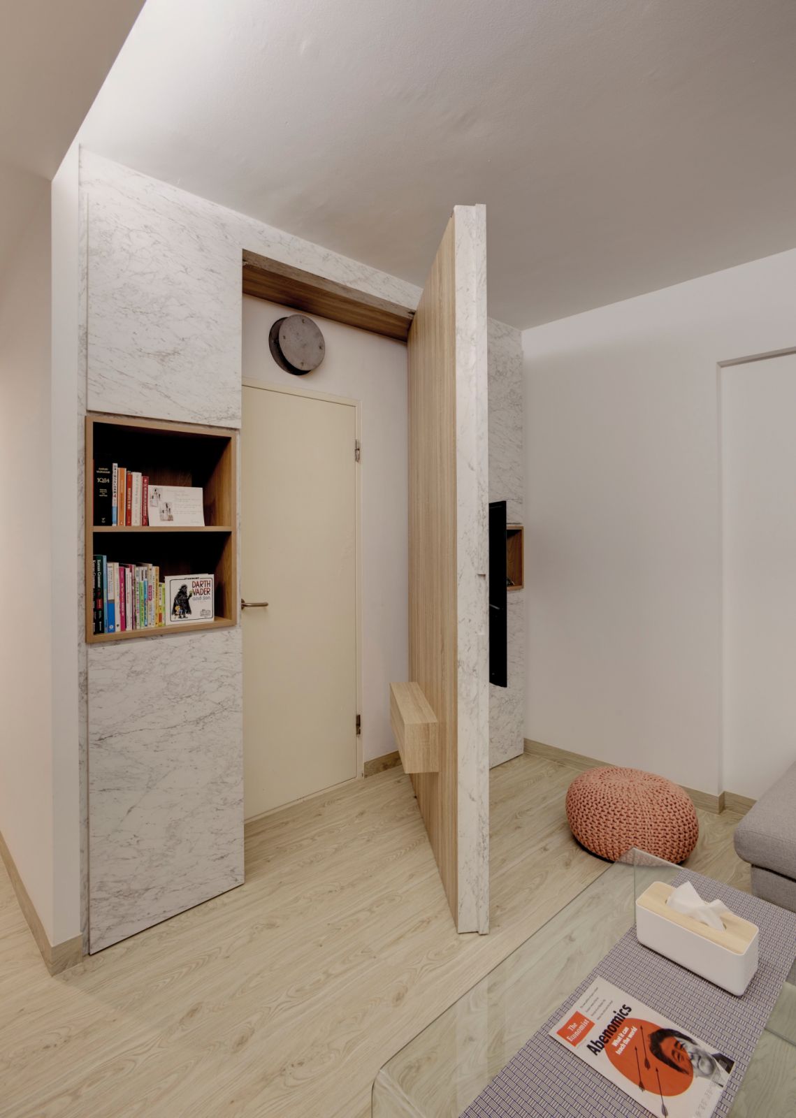 A wrap-around TV feature entirely removes the shelter from view while keeping access to the space within reach