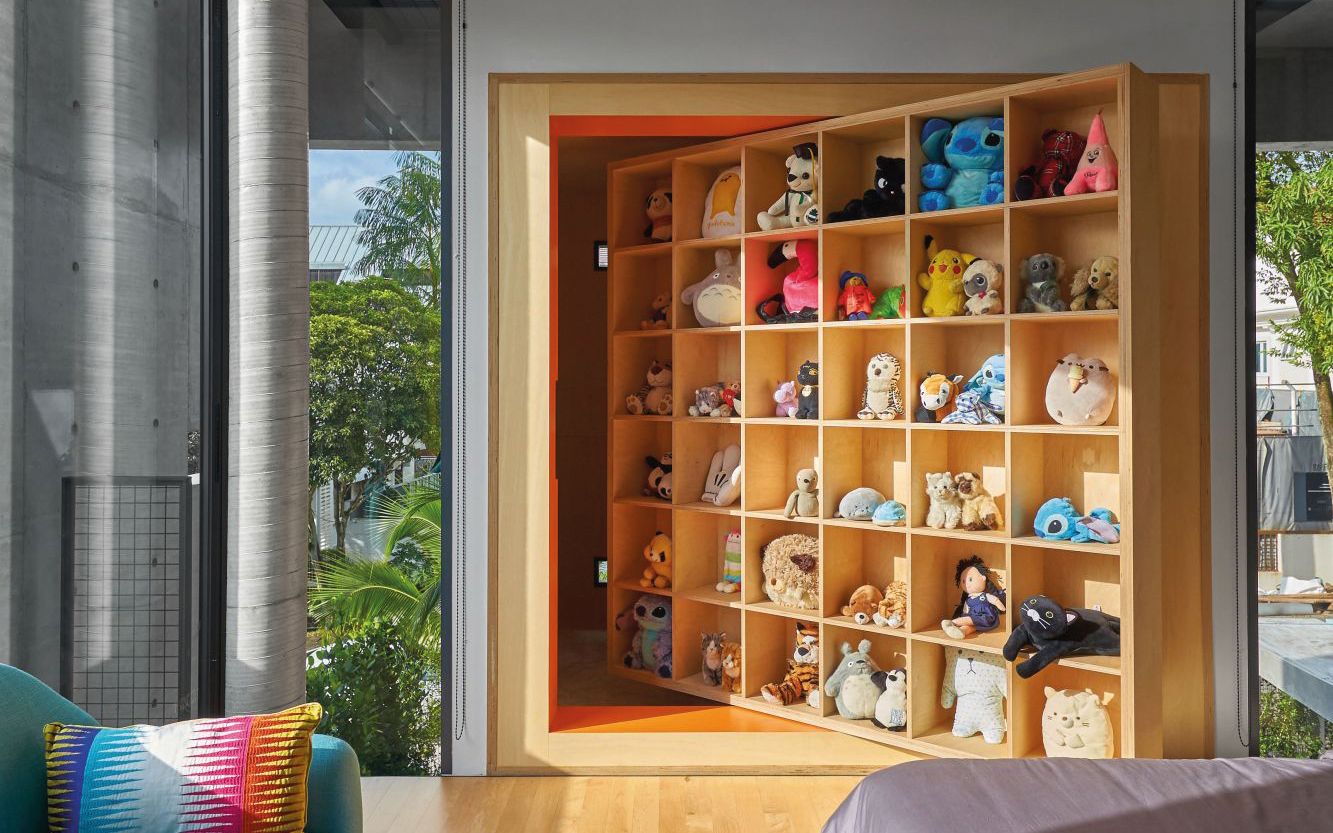 This large display shelf swivels to reveal a private hideaway, dedicated to singing, playing the keyboard and the violin, and other musical pursuits (Photo: Jasper Yu)