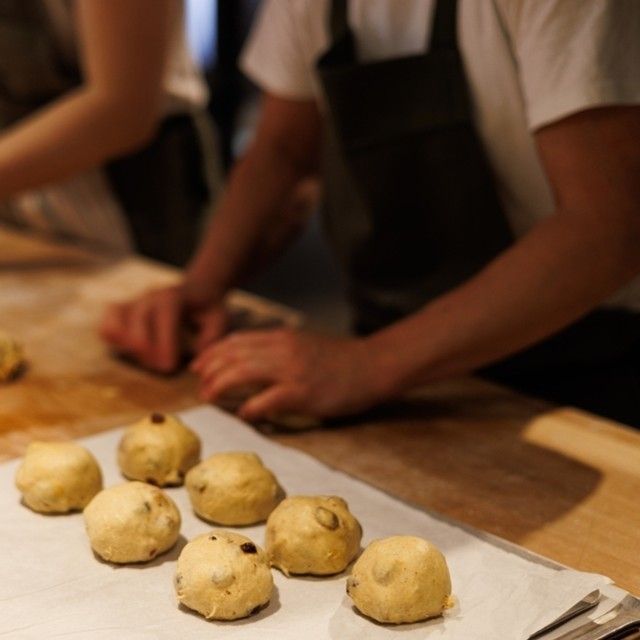 Toklas Bakery in the midst of shaping their hot cross buns, kneading a tea-infused dough and adding cardamon, cloves, cinnamon and Ruby grapefruit and Valentine pomelo peel (Image: Toklas Bakery)