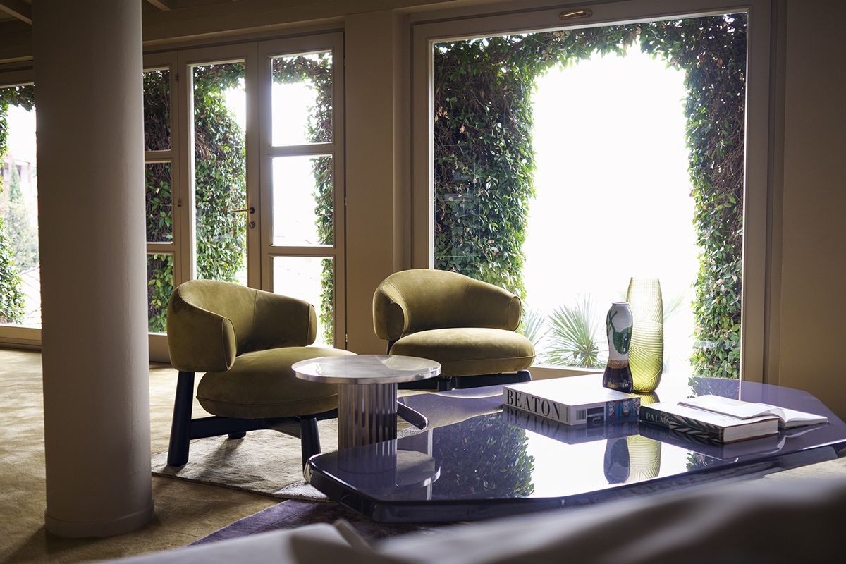 Olaf chairs in Olive and Aegates small table in Grape create a Baxter-signature freshness in this space