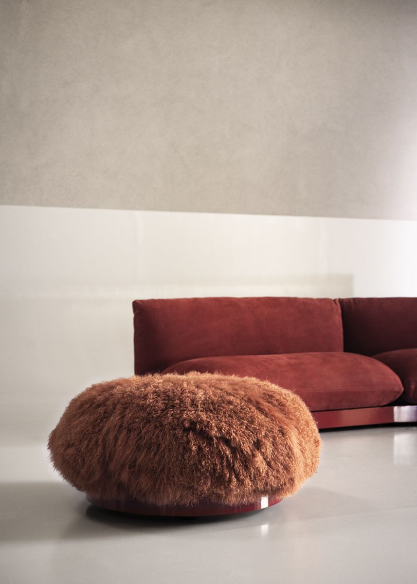 The textural contrast between Aura sofa and pouf adds textural richness to the room