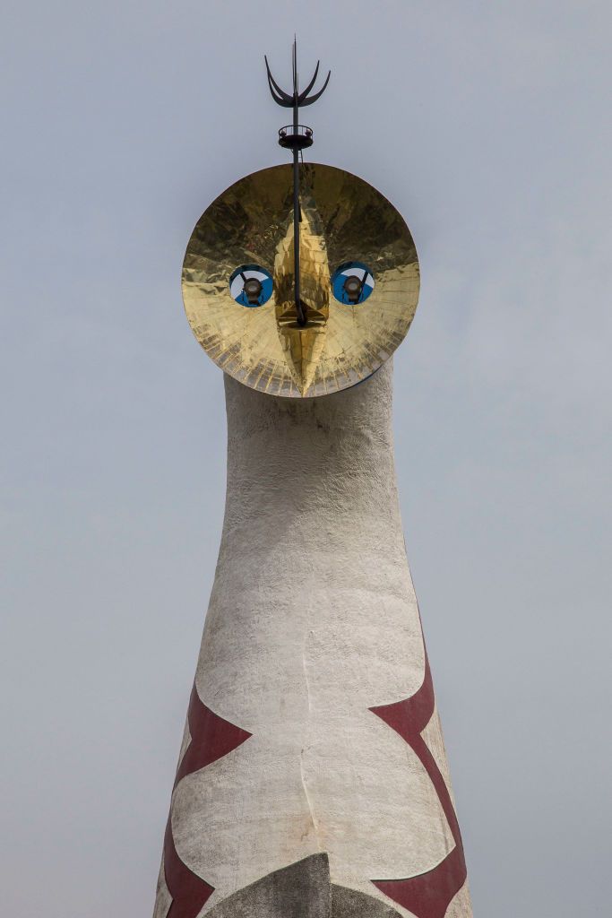 OSAKA, JAPAN - 2017/04/20: Tower of the Sun at Osaka Expo Park is about 65 meters high with three faces; The Golden Mask is on top made of a round steel plate, the Face of the Sun is on the front composed of a round fiberglass plastic plate and the Black Sun on the back is a mosaic made of pieces of ceramic plates. The tower is hollow. The red lightning on the front and the coronas on the back are made with Italian glass mosaic tiles. (Photo by John S Lander/LightRocket via Getty Images)