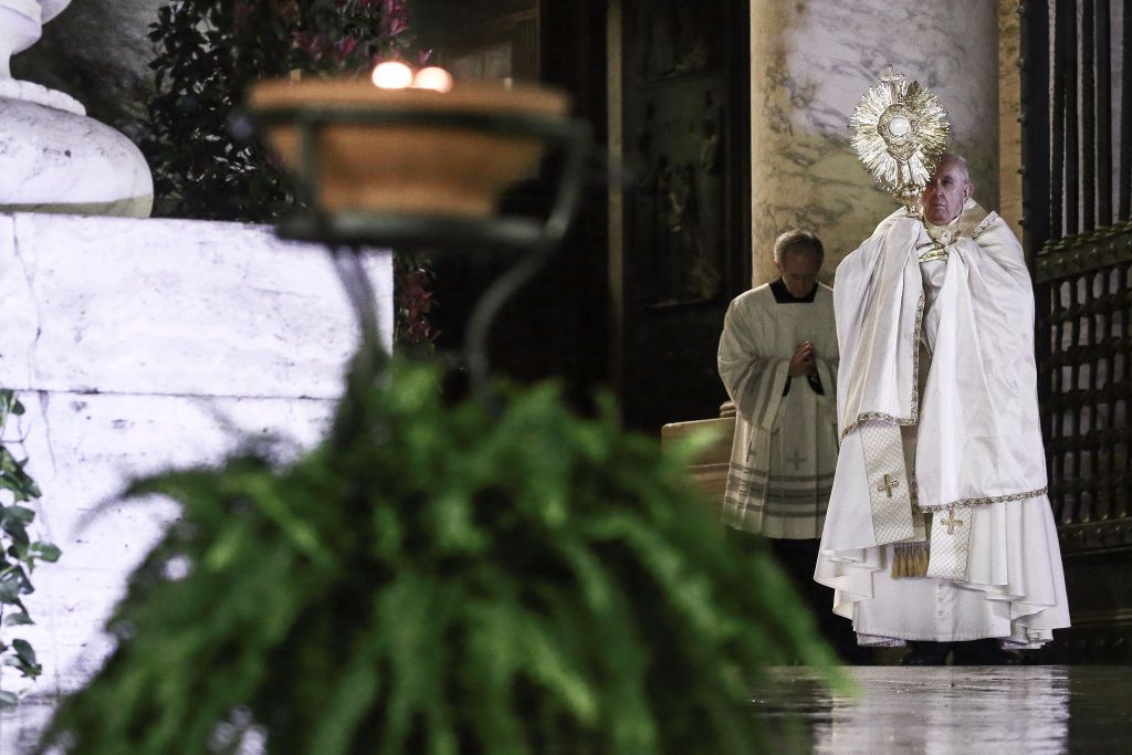 Pope Francis prays on the sagrato of St. Peter's Square to deliver a special Urbi et Orbi Blessing to the world, on March 27, 2020 in Vatican City, Vatican (Photo by Vatican Pool - Corbis/Getty Images)