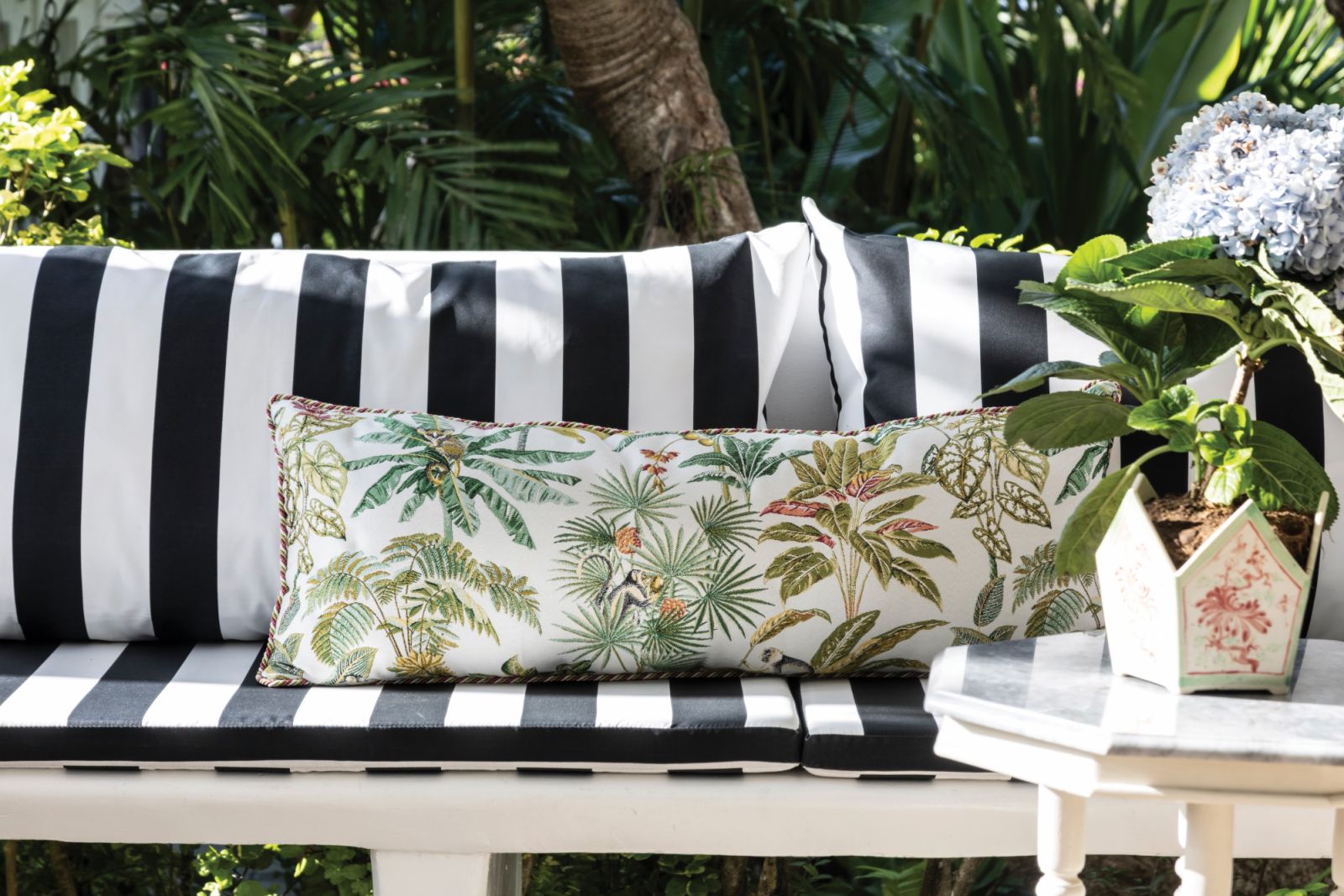 The striped cushions and Boschi’s own line of throw pillows are European, balancing with the Philippine-made furniture